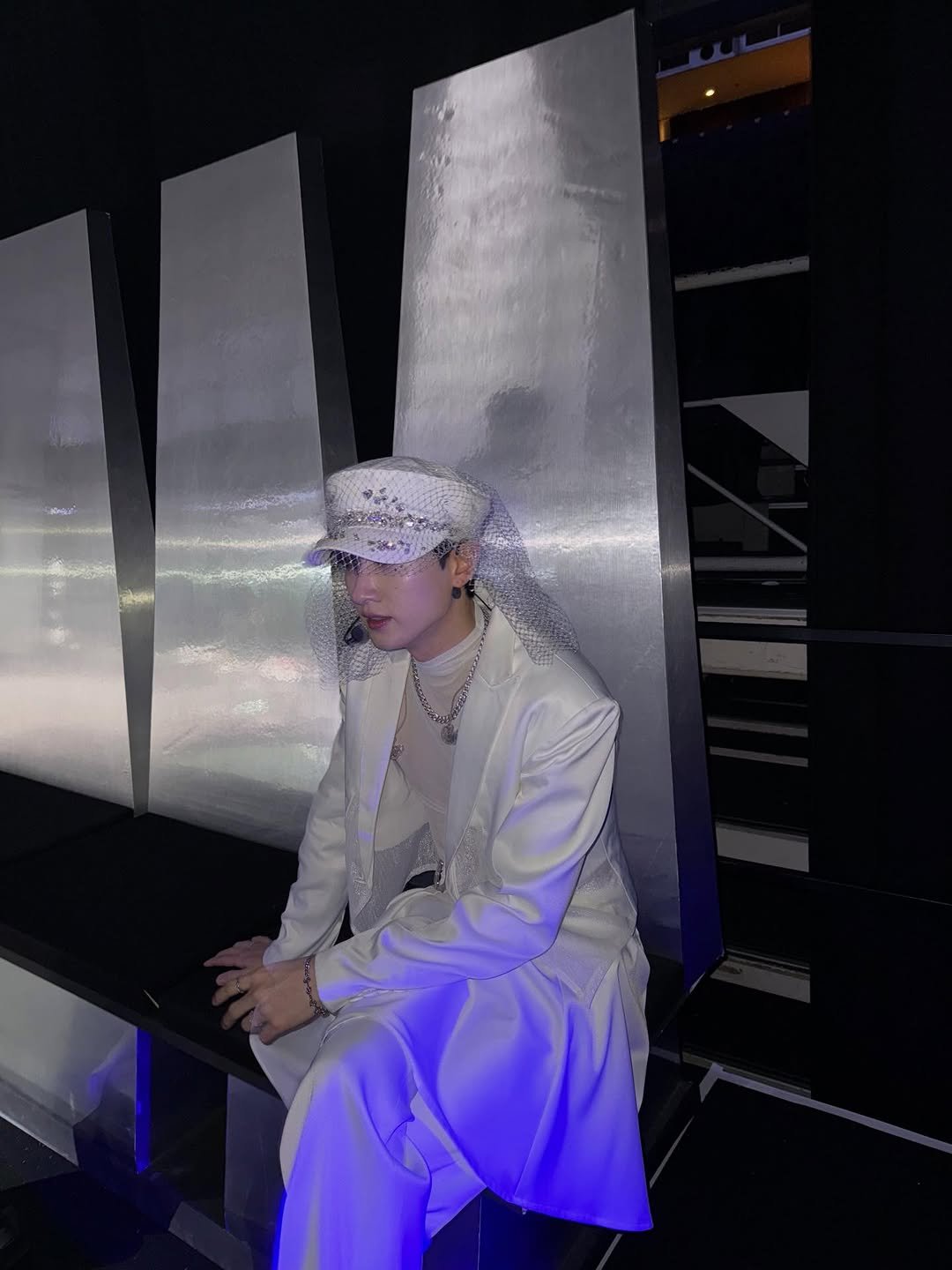 Photo by EUNHYUK on January 03, 2026. May be an image of overcoat, suit, turban, blazer, dinner jacket and text.