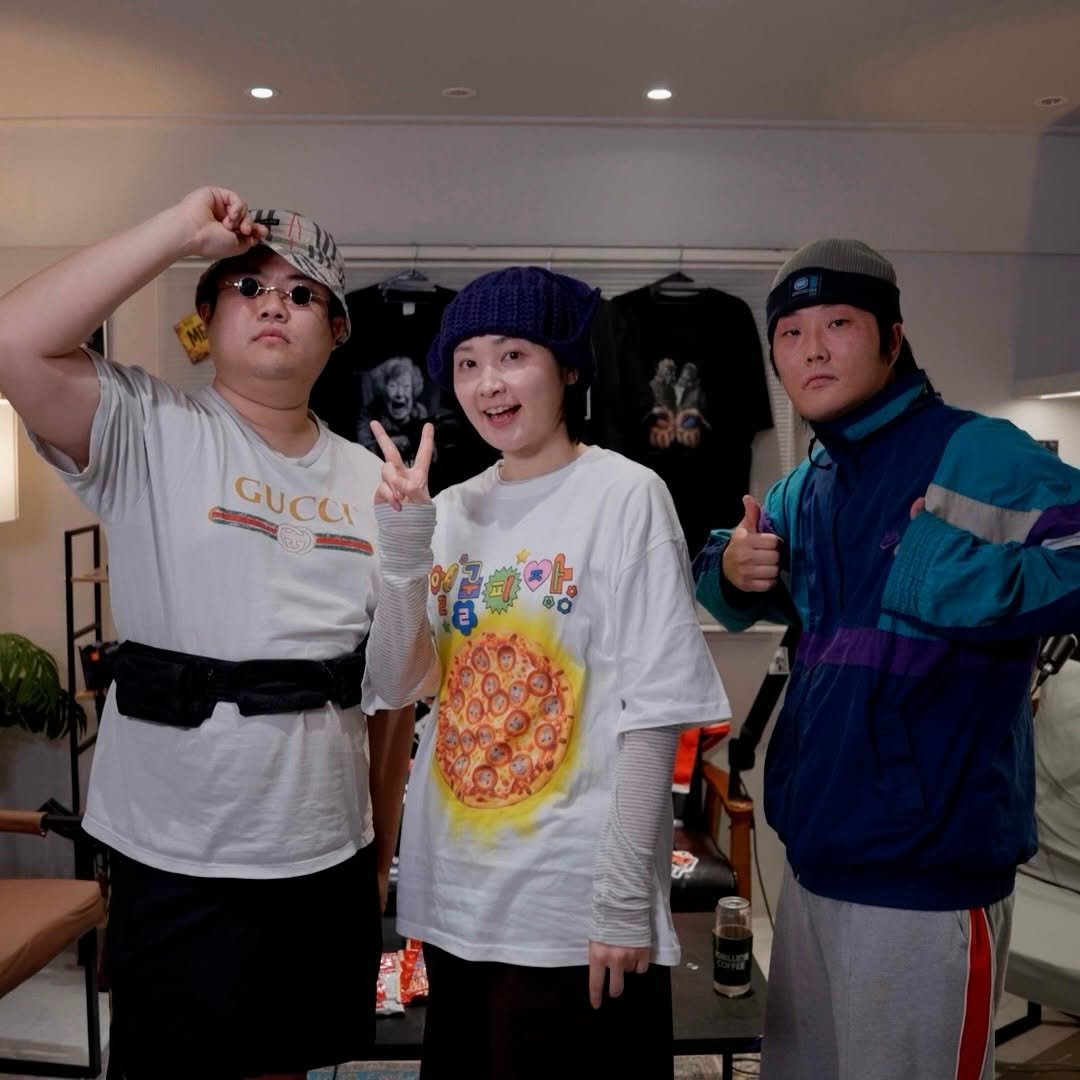 Photo shared by 뷰티풀너드 on February 11, 2026 tagging @chicken_angel. May be an image of one or more people, hat, duffle coat, parka and text.