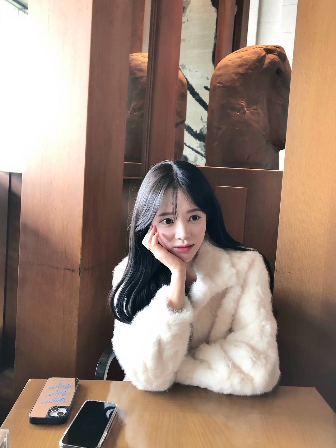 Photo by Lee Seulbi on November 23, 2025. May be an image of one or more people, hair, duffle coat, parka and text.