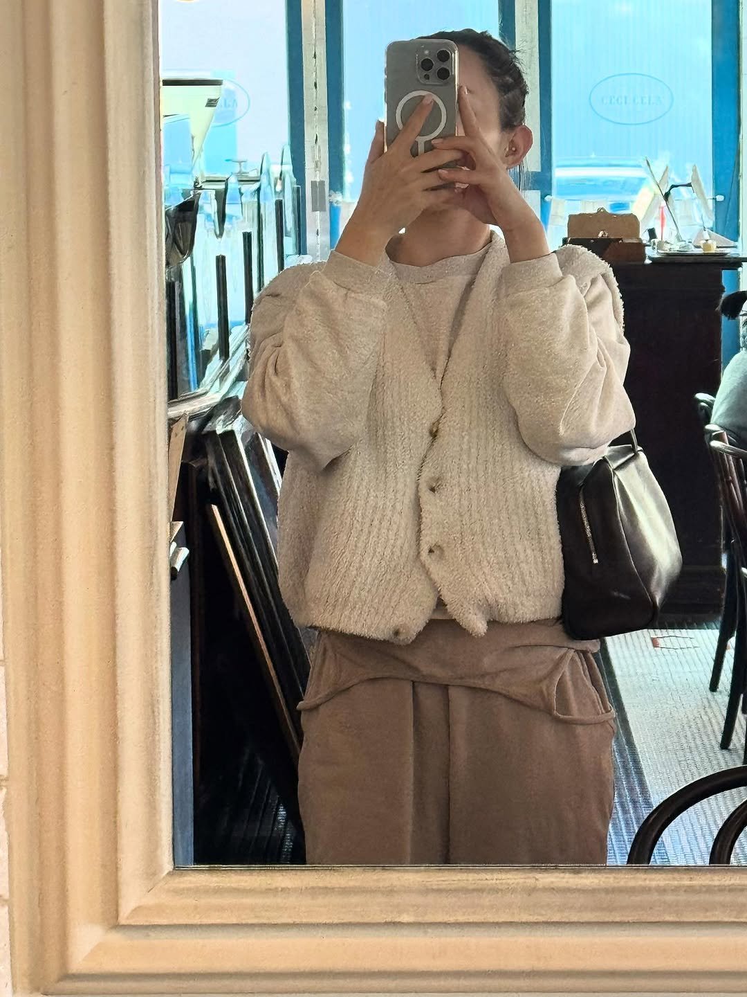 Photo by BELLELEAH on October 28, 2025. May be an image of duffle coat, turtleneck, cardigan, mirror and text.