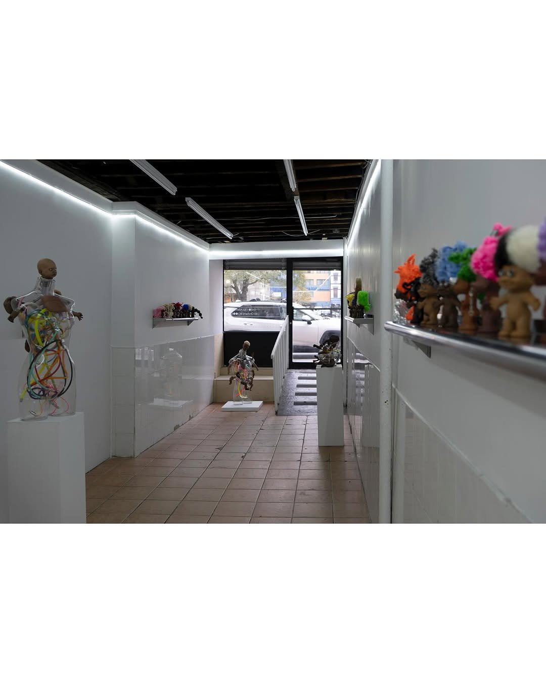 Photo by Below Grand Gallery in Below Grand Gallery with @_terrancejames_, and @mosmosk. May be an image of toy, sculpture, display case and text.