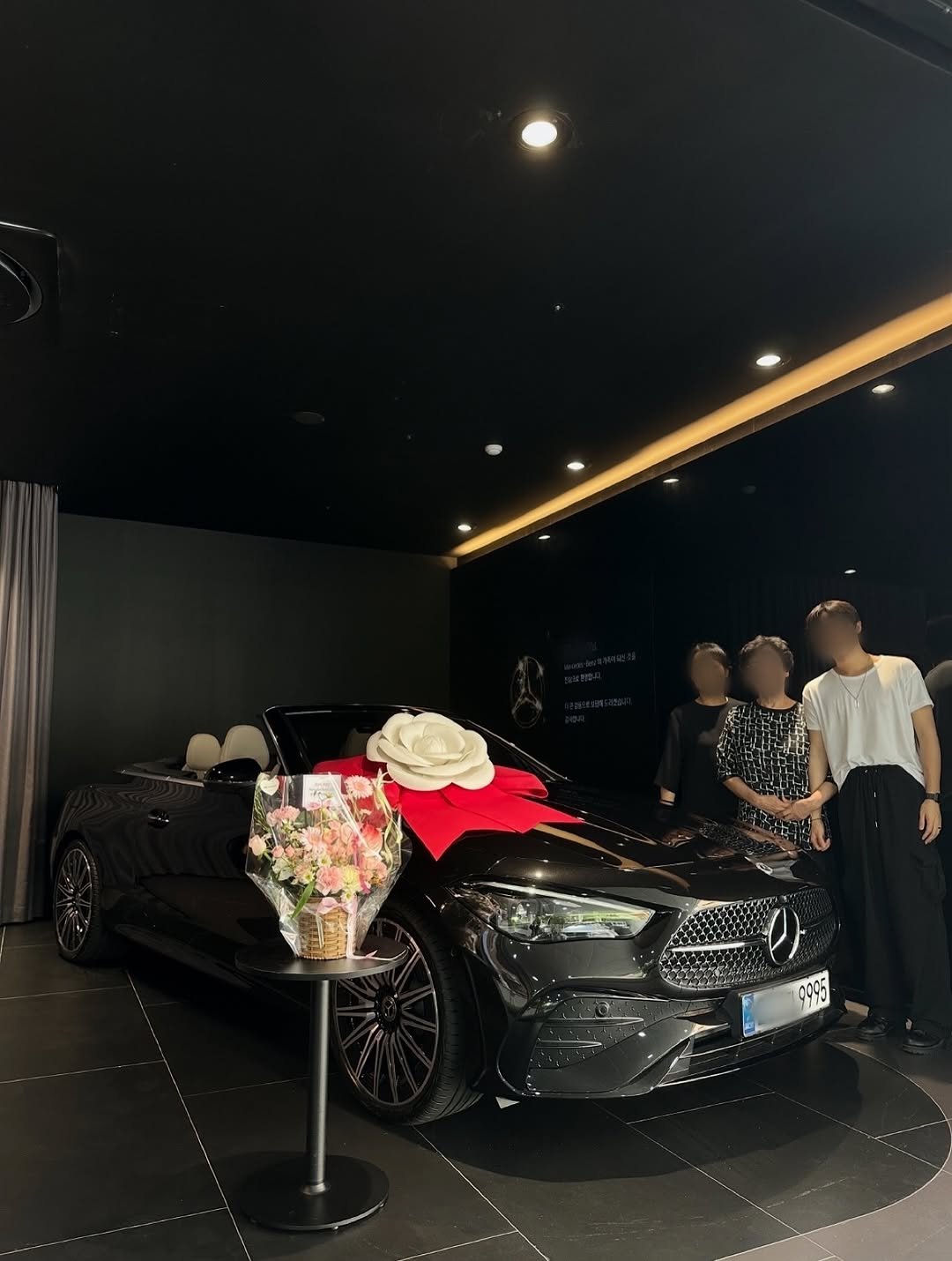 Photo by 벤츠 공식딜러 김대호 on August 03, 2025. May be an image of 3 people, car, convertible and text.