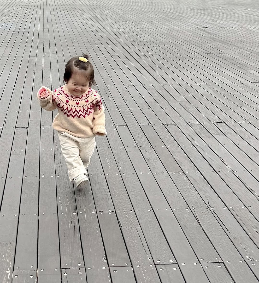 Photo by 김수현  딸기엄마🍓 on January 04, 2026. May be an image of baby, standing, raincoat and text.