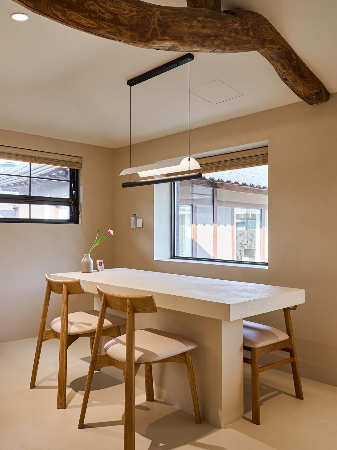Photo shared by BESPACE | 부산인테리어 | 대구인테리어 | 경주인테리어 | 상가인테리어 on January 20, 2026 tagging @architecturephoto.ydg186, @bespace_s, @bespace_official, and @stay_woom_gyeongju. May be an image of table, lighting, kitchen table, dining table, indoors, kitchen and text.