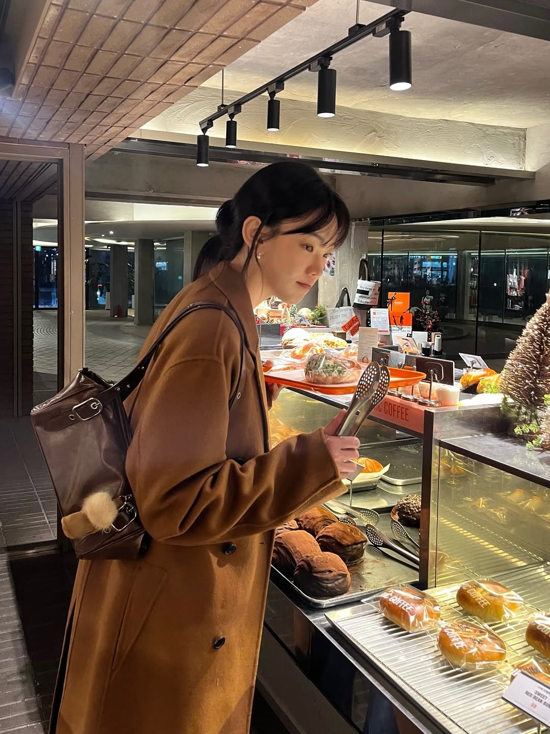 Photo shared by 방은정  BANG EUN JEONG on December 20, 2025 tagging @fractal1.4_official. May be an image of duffle coat, overcoat, parka, bread, pie and text.