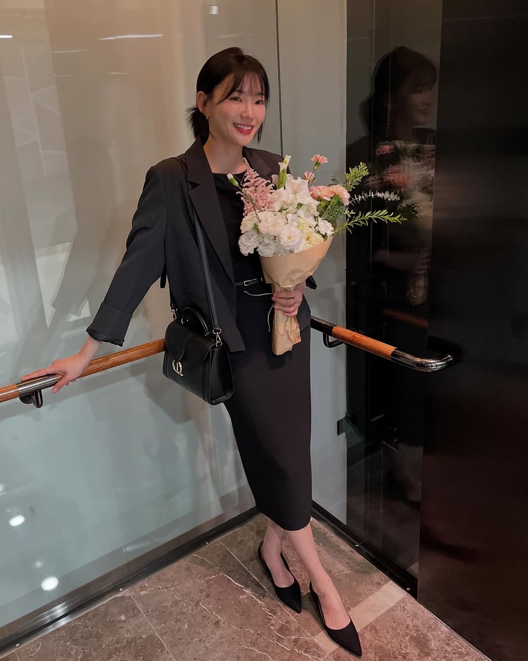 Photo shared by 방은정 BANG EUN JEONG on May 26, 2025 tagging @louisquatorze_official. May be an image of 1 person, clarinet, oboe, baby's-breath, prairie gentian and white lily.