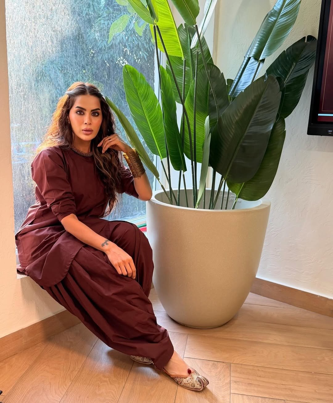 Photo shared by Bhavana Singh on April 27, 2026 tagging @ritikaaroracouture. May be an image of dress, jumpsuit and text.