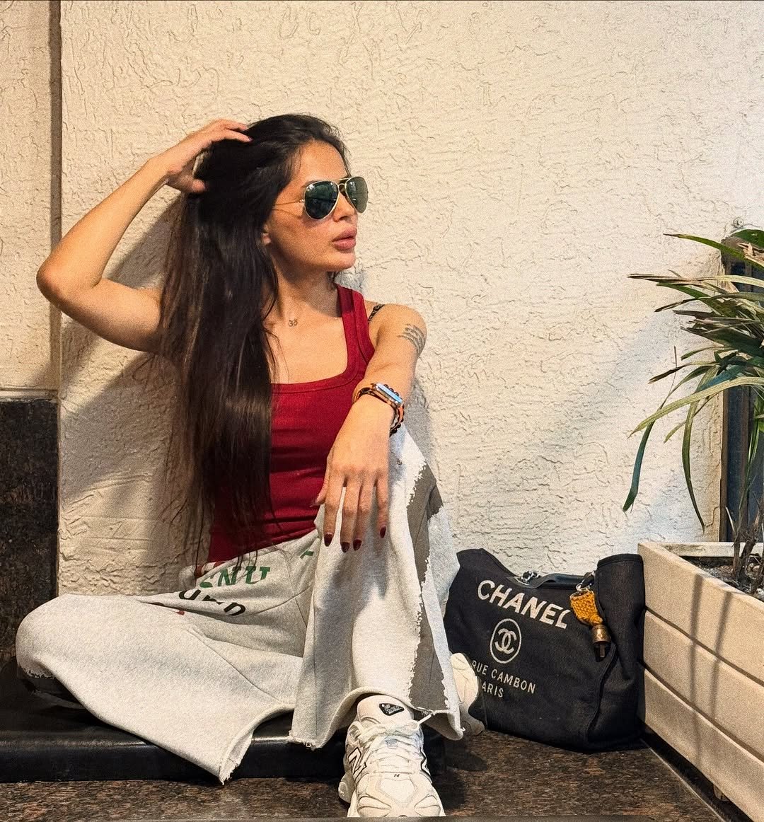 Photo by Bhavana Singh on October 05, 2025. May be an image of one or more people, hair, sweatpants, sunglasses and text.