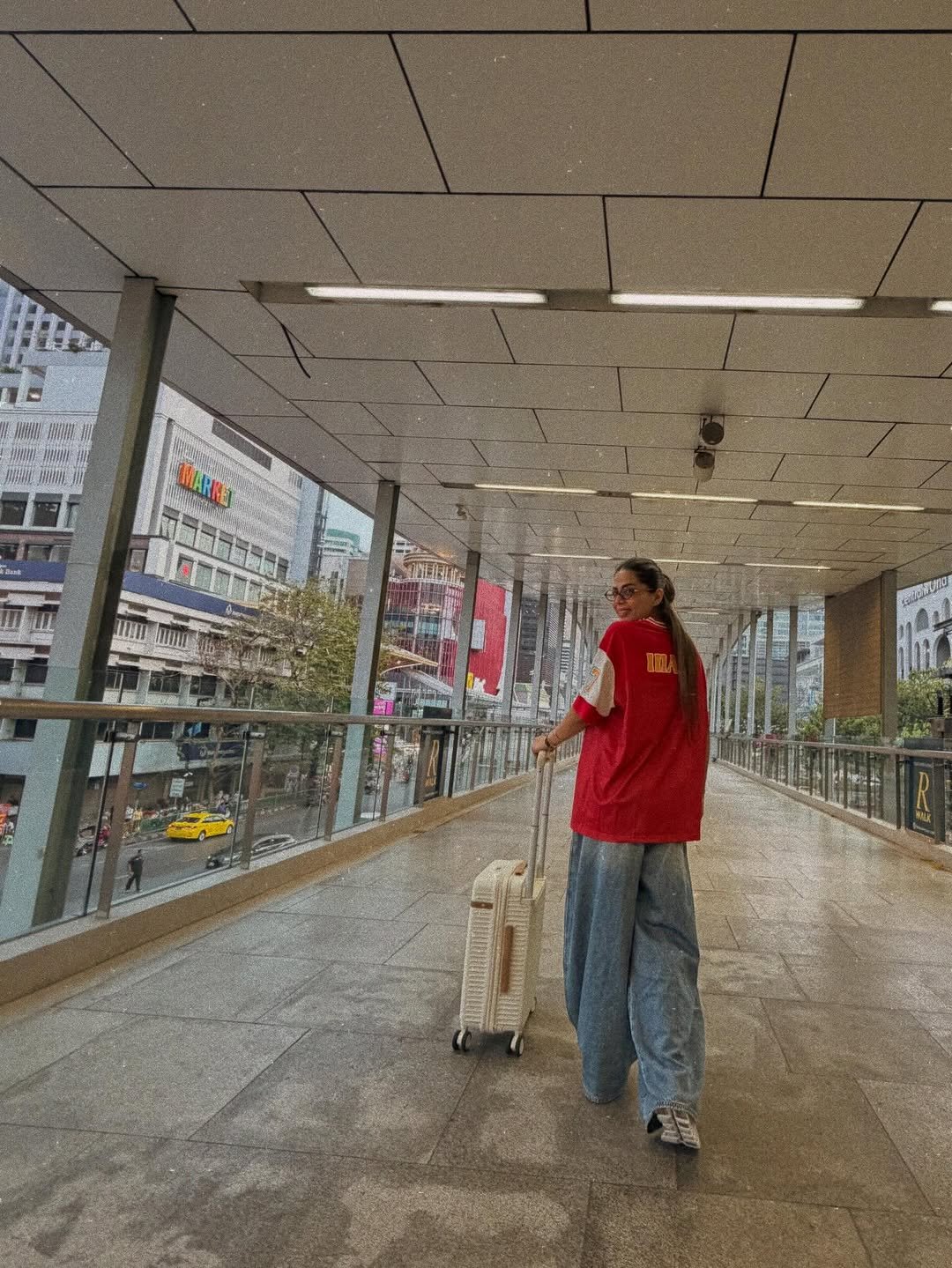 Photo by Bhavana Singh on February 24, 2026. May be an image of one or more people, street, hallway, terminal and text.