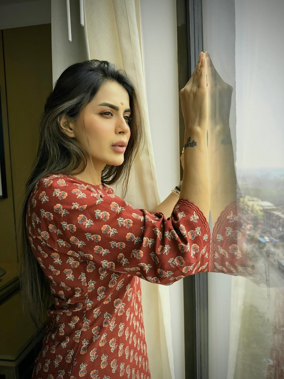 Photo shared by Bhavana Singh on February 27, 2026 tagging @ritikaaroracouture. May be an image of one or more people, makeup, curtains, window and text.