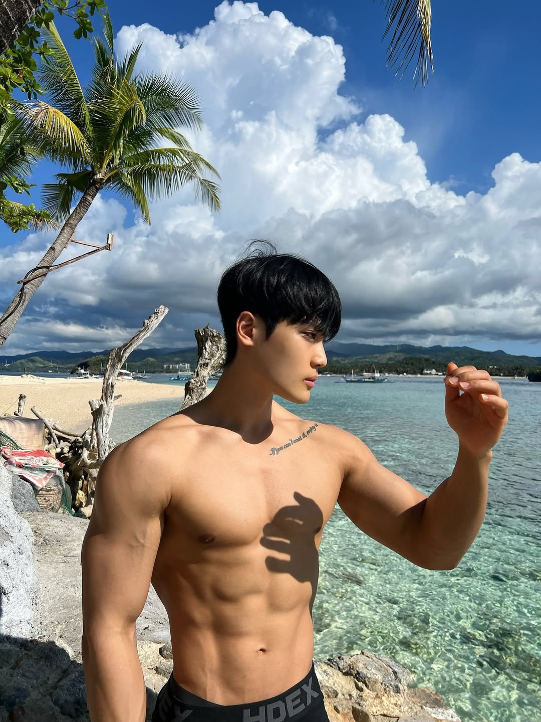 Photo by 지 우 on July 15, 2025. May be an image of 1 person, biceps, body building, underwear, beach and text.