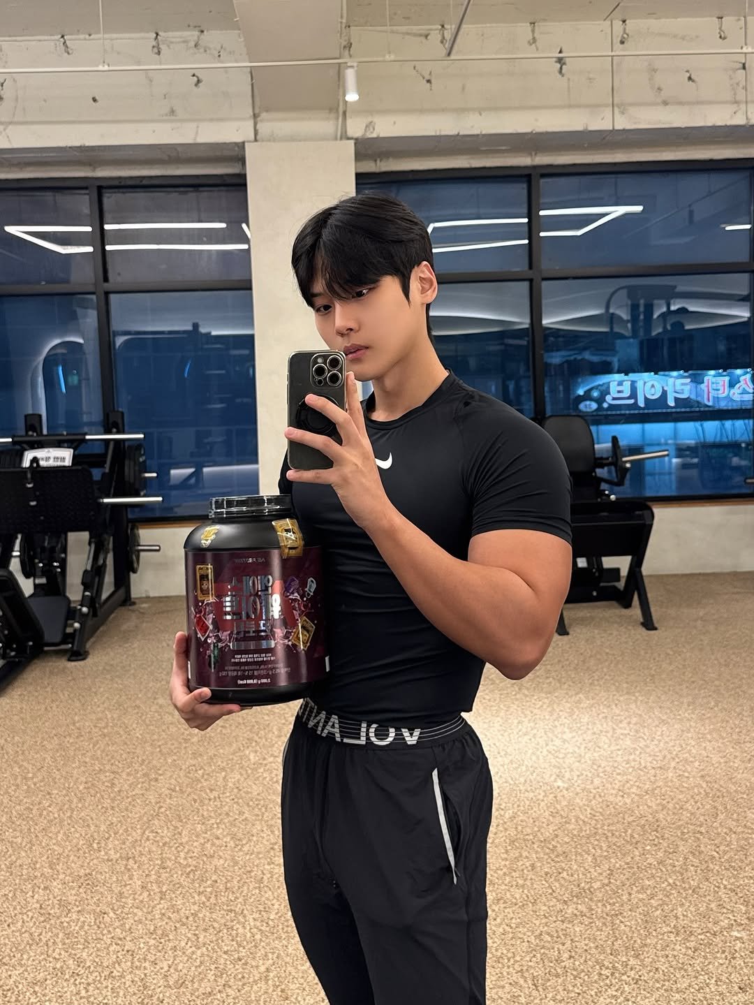 Photo shared by 지 우 on November 30, 2025 tagging @nsprotein_official. May be an image of one or more people, biceps, people bodybuilding, jug, sportswear, shaker and text.