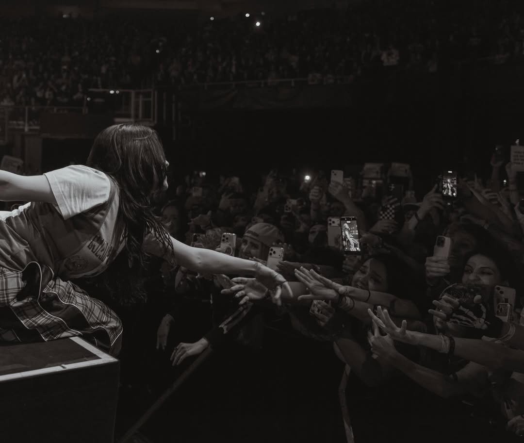 Photo shared by BILLIE EILISH on November 21, 2025 tagging @henryhwu. May be a black-and-white image of crowd, concert and text.