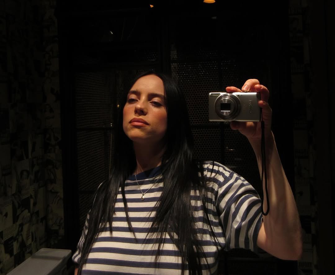 Photo by BILLIE EILISH on November 06, 2025. May be an image of phone, camera, mirror and text.