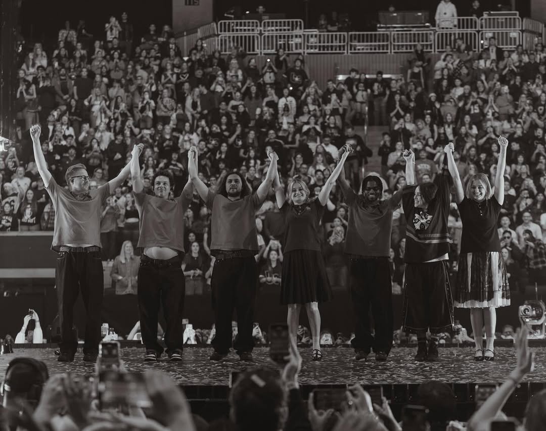 Photo shared by BILLIE EILISH on December 04, 2025 tagging @liminalofficial, @henryhwu, @janedillonhorner, @thesuavesolo, @marshalldrums, @avahorner, and @_cheb_brahim. May be a black-and-white image of crowd, concert and text.