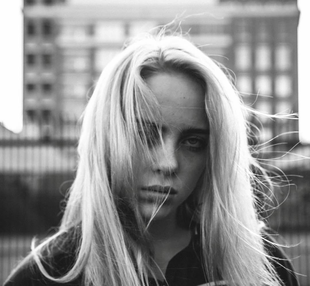 Photo by BILLIE EILISH on January 15, 2026. May be a black-and-white image of one or more people, blonde hair, makeup, people smoking and text.