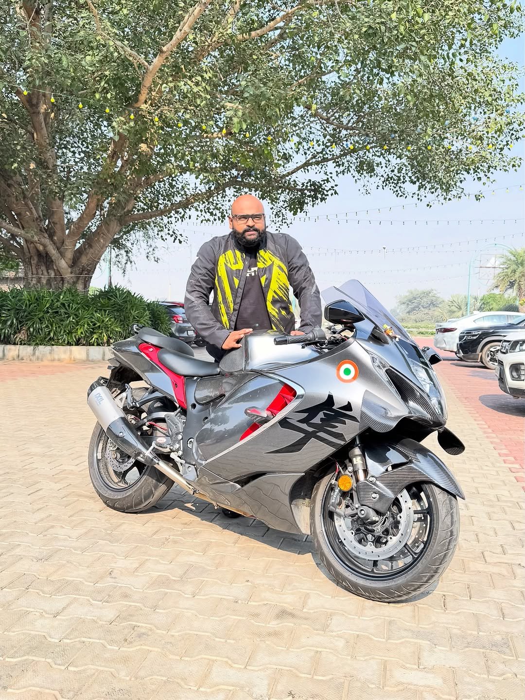 Photo by Inderdeep Singh on October 19, 2025. May be an image of motorcycle, helmet, scooter, road and text.