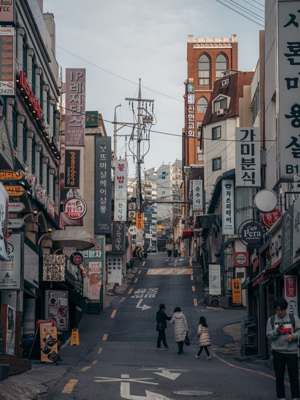 Photo by BZCF | 비즈까페 on February 11, 2026. May be an image of street, telephone pole, buildings and text.