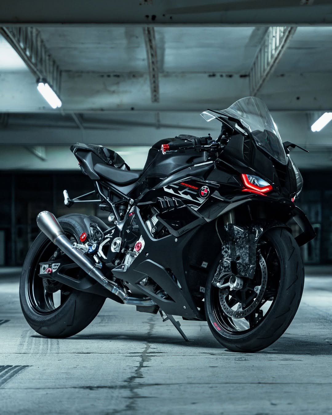 Photo by BMW Motorrad on December 15, 2025. May be an image of motorcycle, helmet, wheel and text.