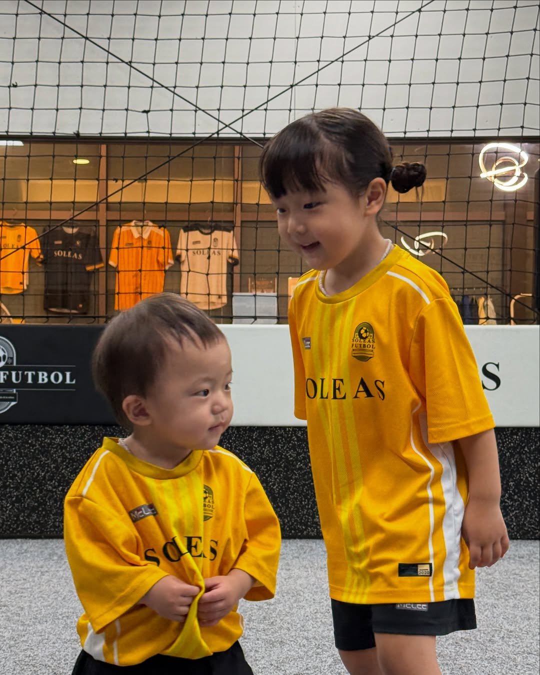 Photo shared by 석아영 on July 27, 2025 tagging @with_soleas, and @soleasfutbol_gwanggyo. May be an image of 2 people, child, people playing soccer, sports equipment and text.