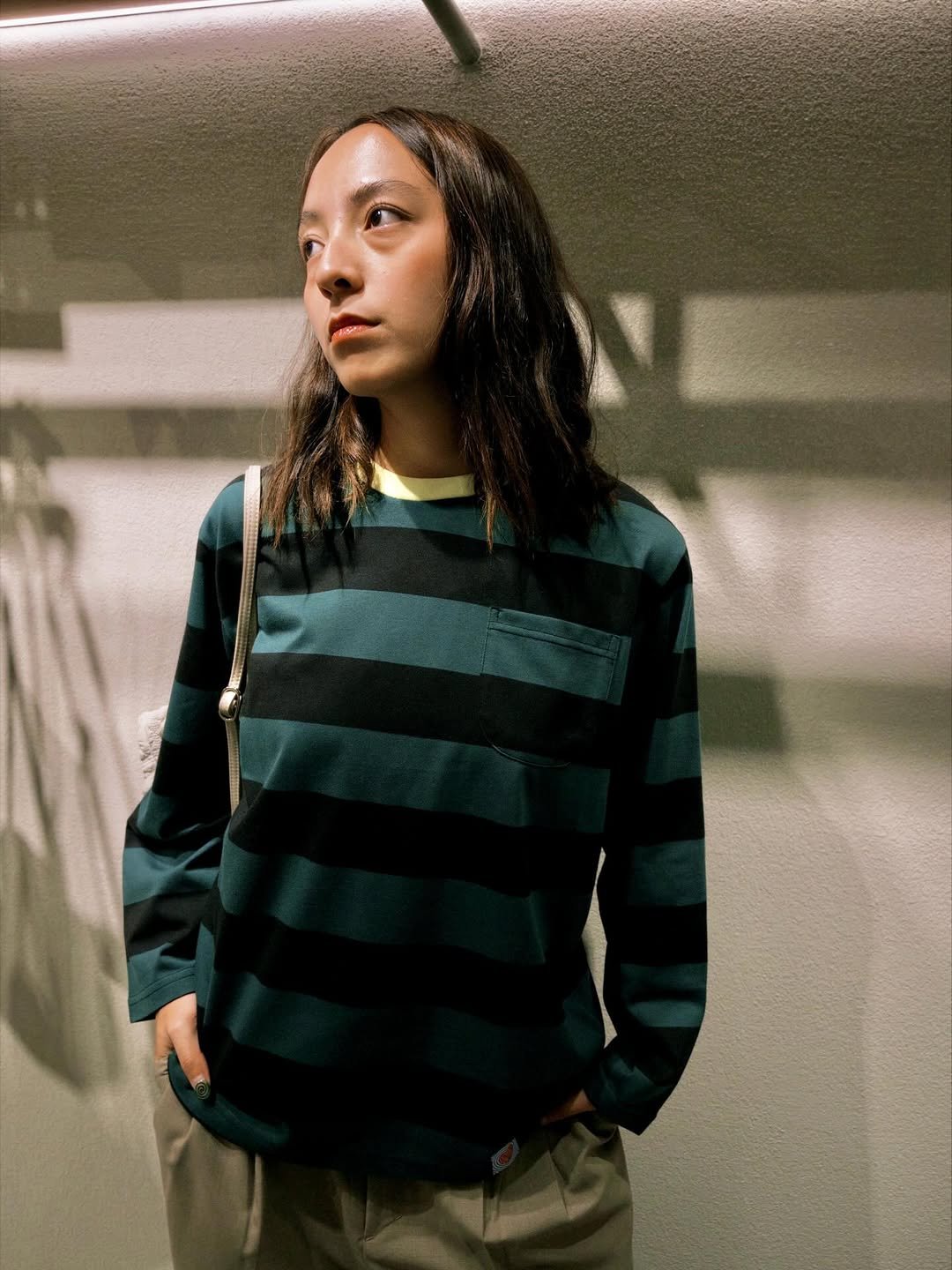 Photo by BOBO TOKYO on March 30, 2026. May be an image of one or more people, parka, turtleneck, sweatshirt, stripes and text.