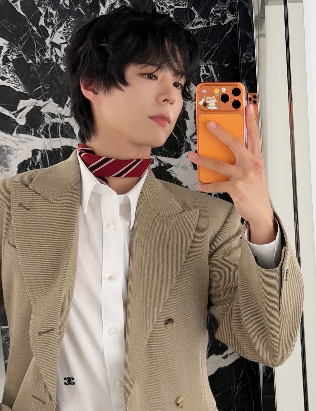 Photo shared by 박보검 PARK BO GUM on December 21, 2025 tagging @celine, and @bogummy. May be an image of one or more people, hair, blazer, bolo tie, top and text.