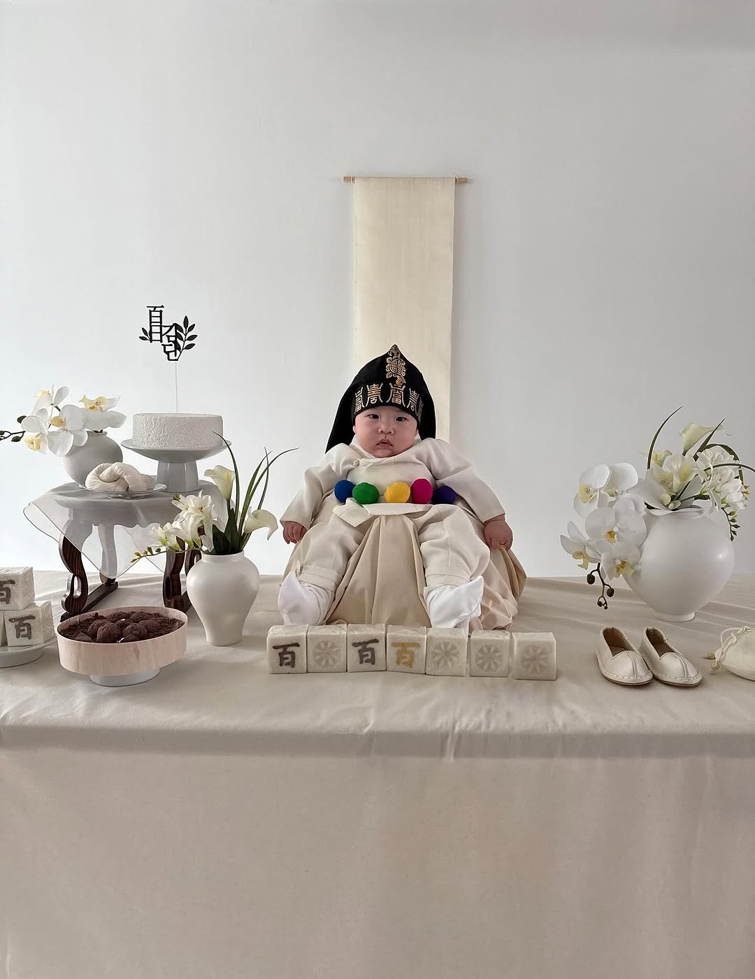 Photo shared by OUR on September 30, 2025 tagging @kim_ddan. May be an image of 1 person, lego, cake and text.