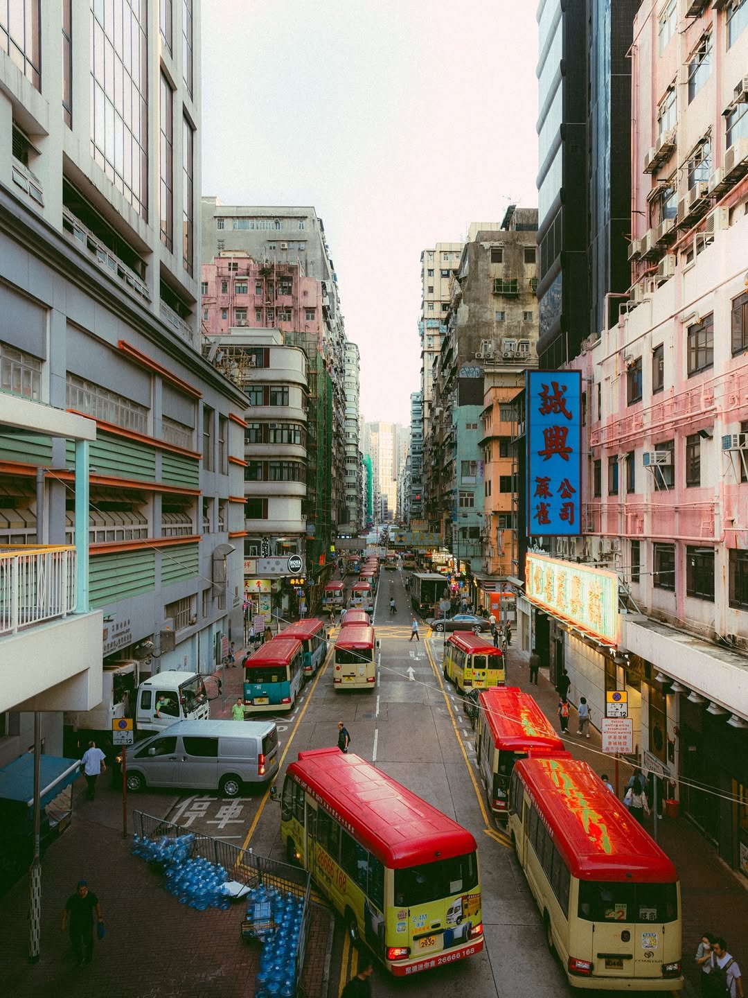 Photo shared by 봉토그래퍼 📷 on March 16, 2026 tagging @discoverhongkong, @sonykorea, @sonyalpha, @voyaged, and @hongkong.explore. May be an image of one or more people, bus, road, street, buildings and text.