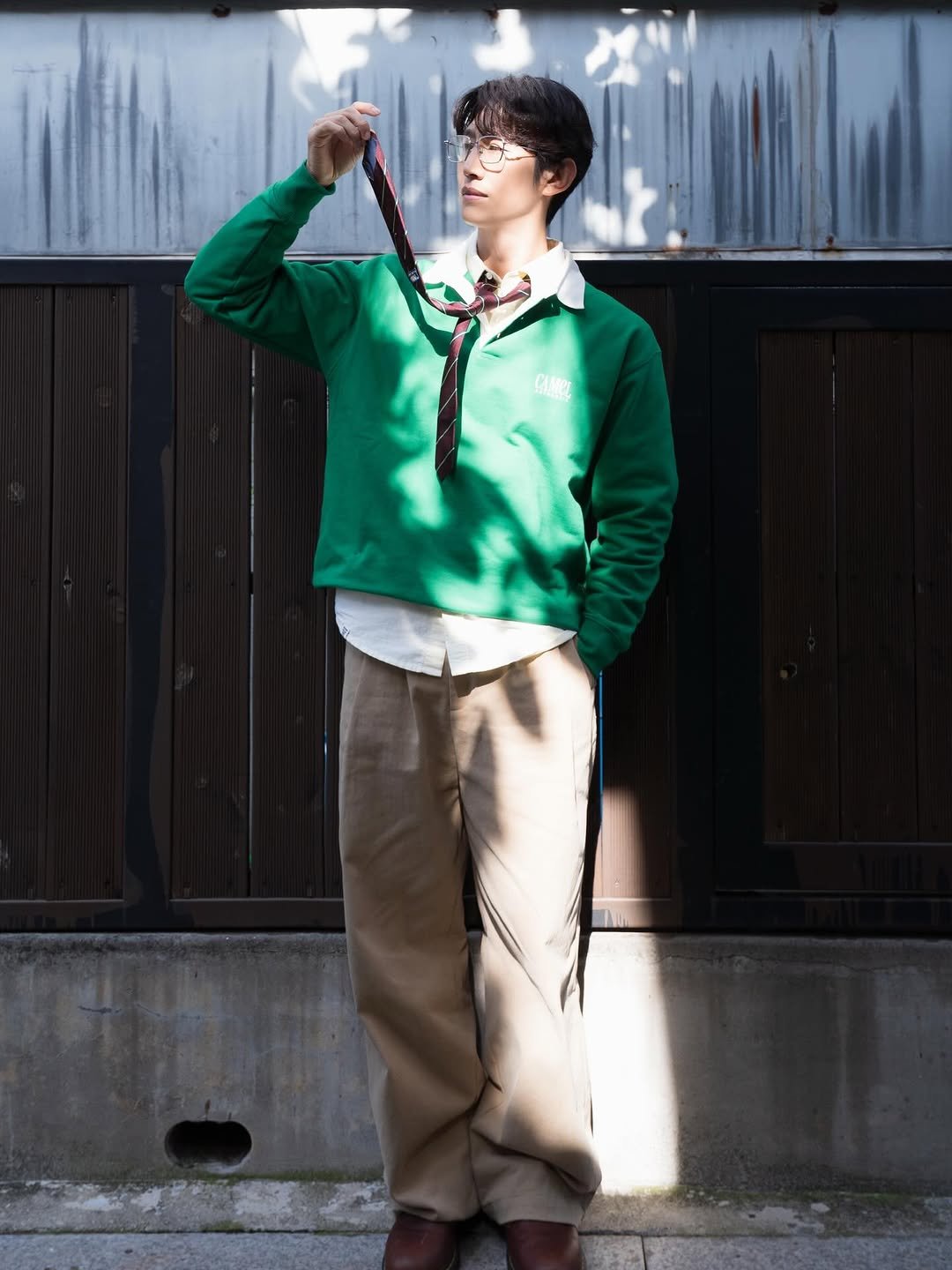 Photo by 강기영 Kiyoung Kang on February 12, 2026. May be an image of duffle coat, sweater, bolo tie and text.