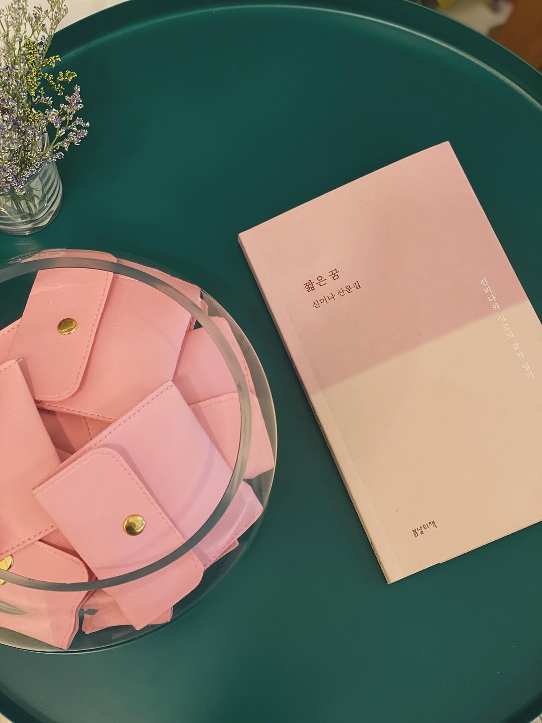 Photo by 책 의 기 분 on April 24, 2026. May be an image of saddle-stitched leather, diary, leather wallet, purse, pouch, placemat and text.