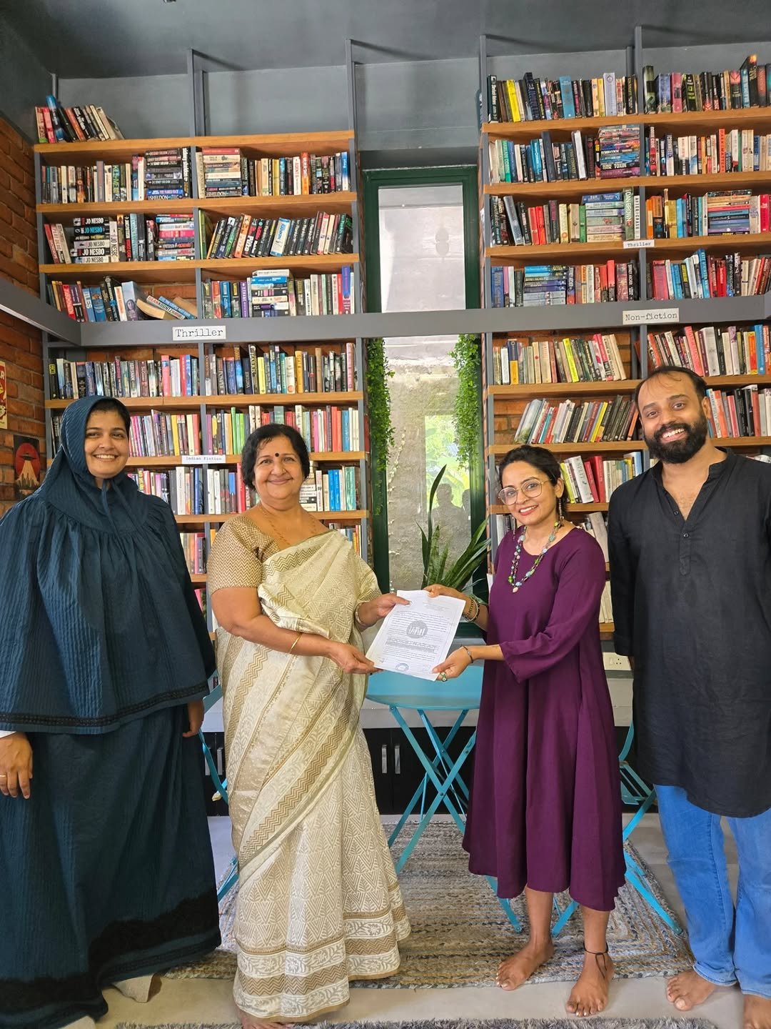 Photo shared by wordU on October 27, 2025 tagging @the_archness, @thereadingroomtvm, @ekaurchai, @authorashvinraj, @booksthakam, @drgeethasnair, and @uninked_poetry. May be an image of one or more people, book and text.