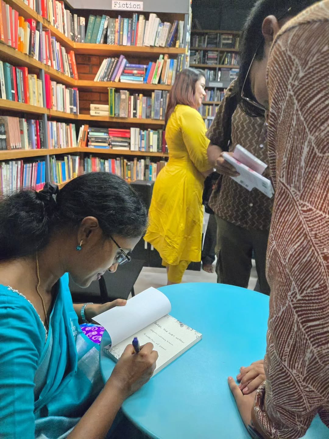 Photo shared by Booksthakam on November 11, 2025 tagging @gayilkg16. May be an image of one or more people, people studying, book, office and text.