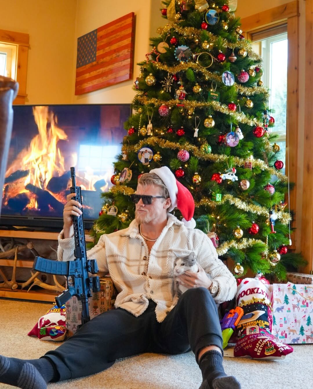 Photo by Brandon Clark on December 25, 2025. May be an image of christmas tree, fireplace, glasses and text.