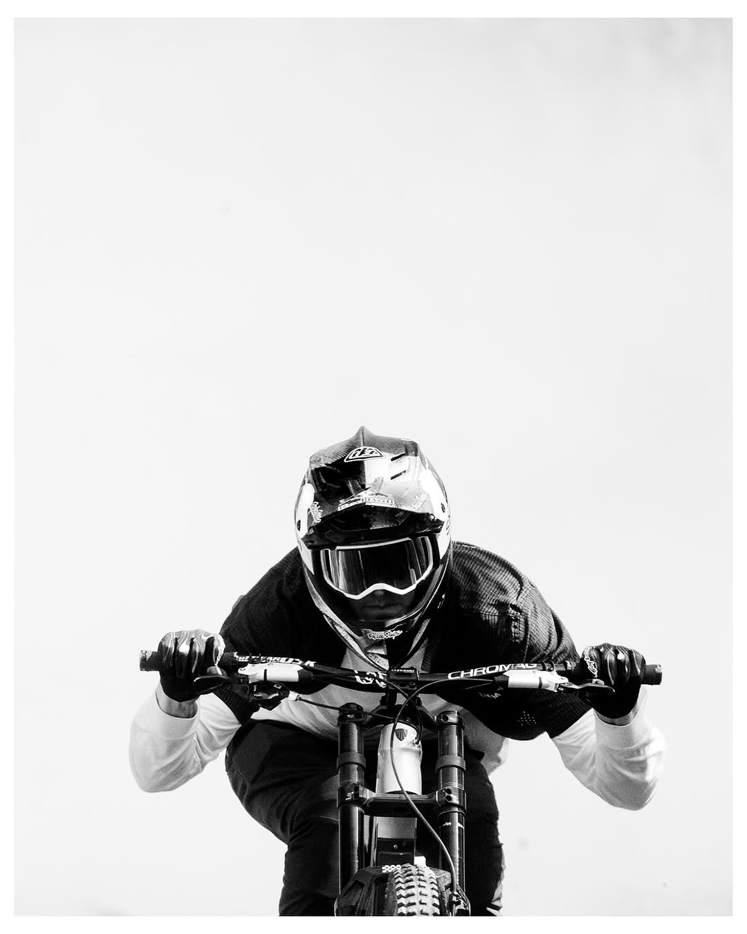 Photo shared by Brandon Semenuk on September 25, 2025 tagging @tobycowley, and @oclevercircle. May be a black-and-white image of racing vehicles, dirt bike, motorcycle, helmet, scooter and text.