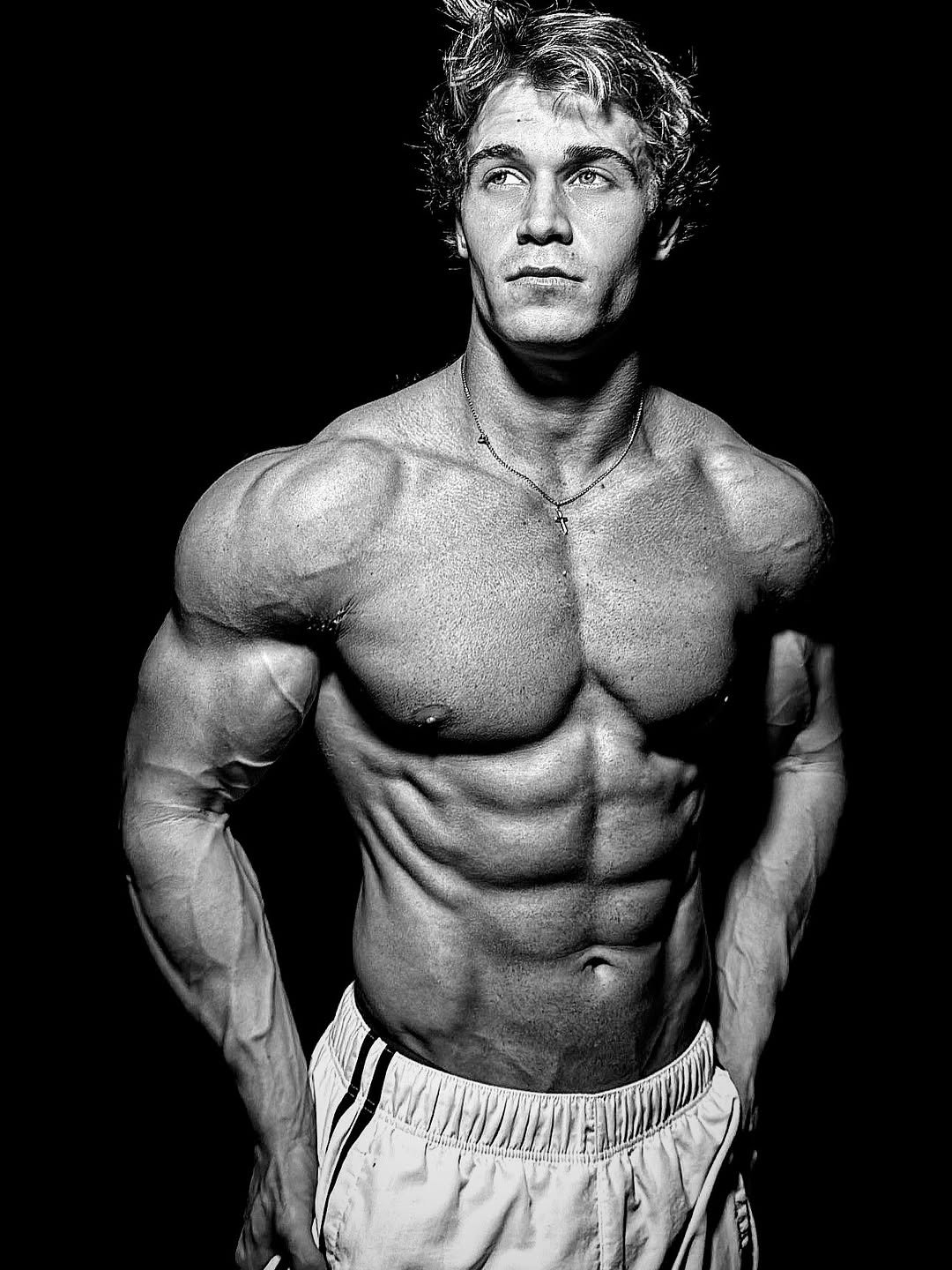 Photo by Brandon Starr on December 23, 2025. May be an image of one or more people, biceps, people bodybuilding and text.