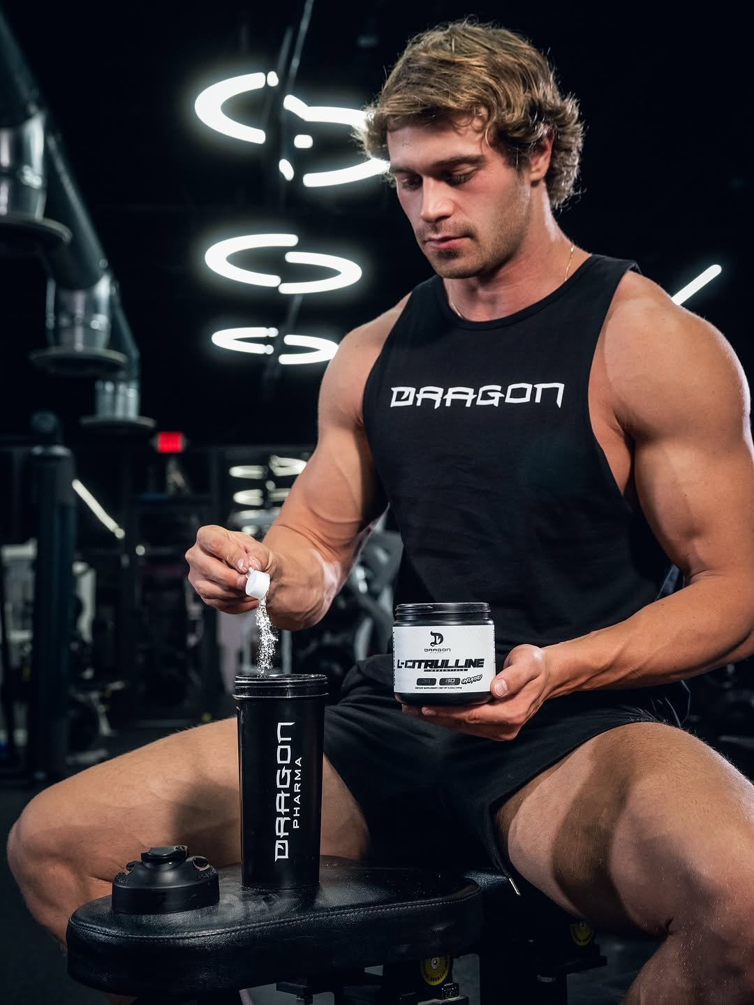 Photo shared by Brandon Starr on November 09, 2025 tagging @dragonpharma_llc. May be an image of one or more people, biceps, people bodybuilding, shaker, barbell, sportswear and text.