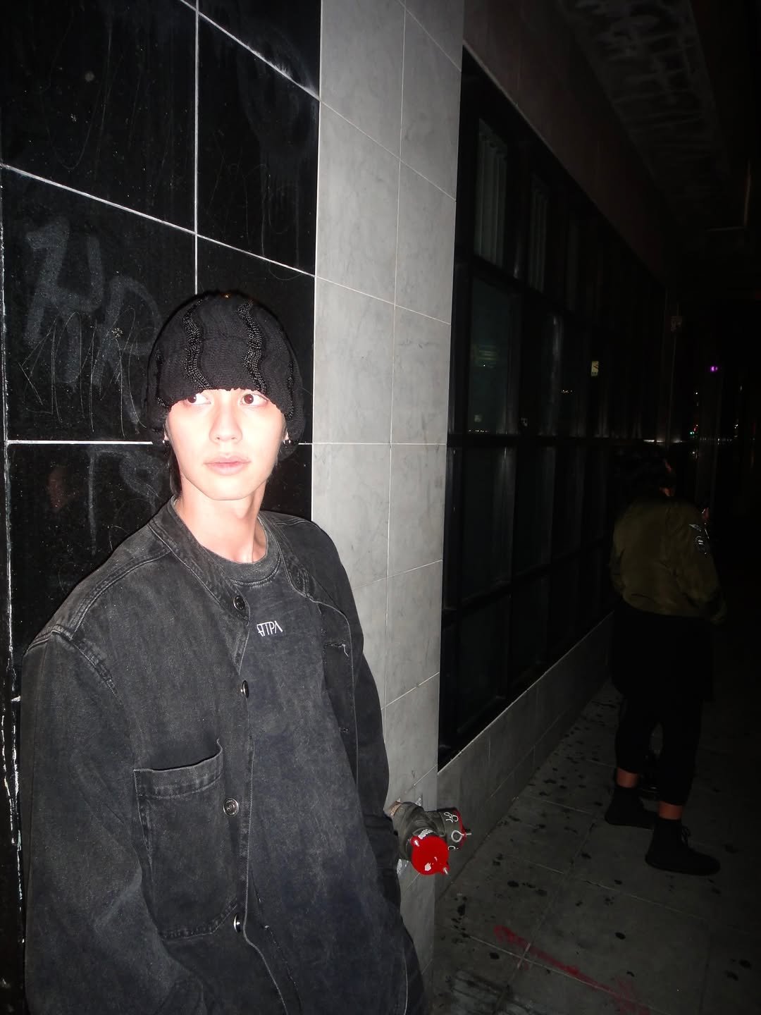 Photo by BRIGHT on November 28, 2025. May be an image of standing, cigarette, parka, beret and text.