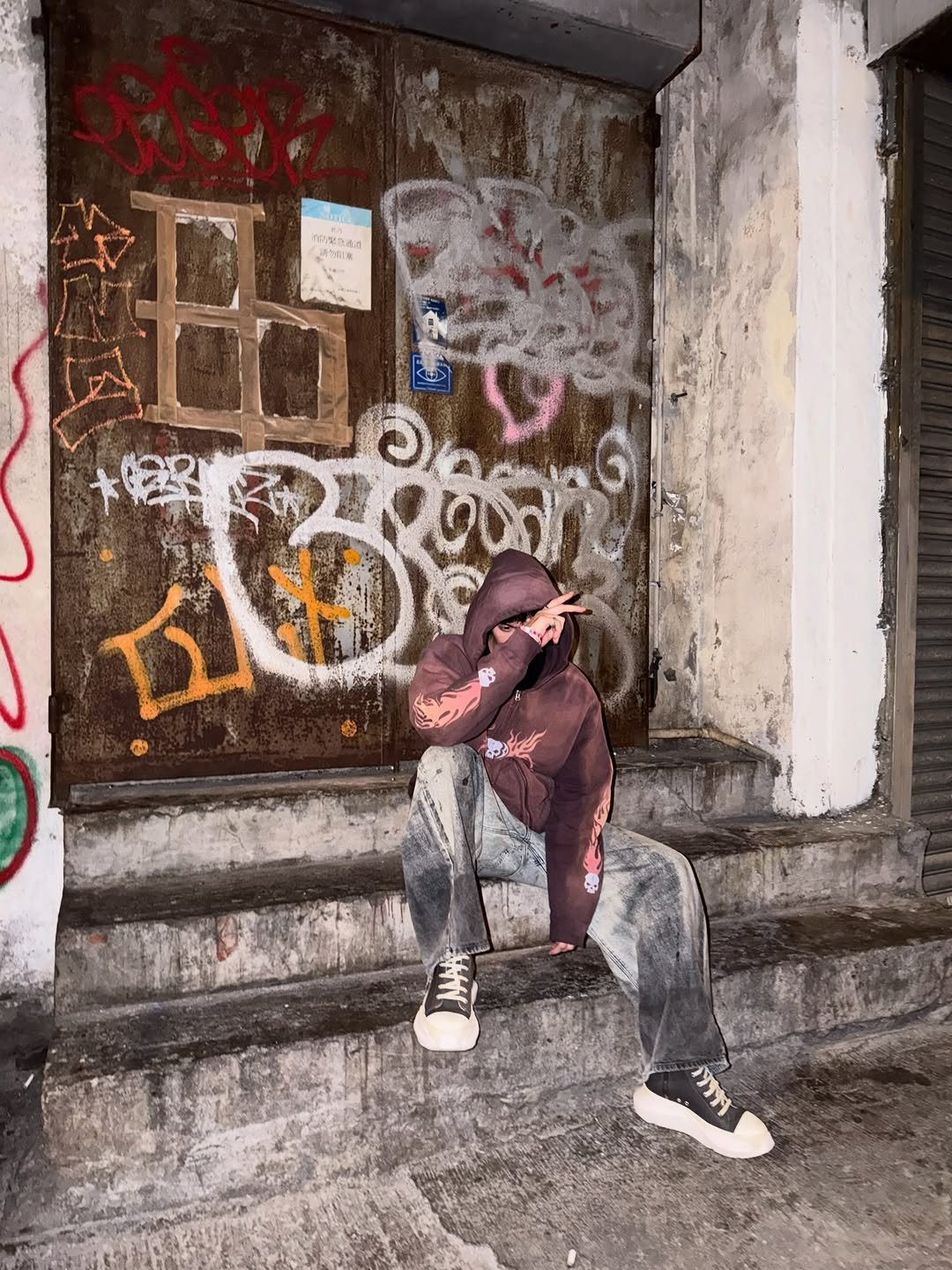 Photo by BRIGHT on March 21, 2026. May be an image of fire escape, cigarette, street and text.