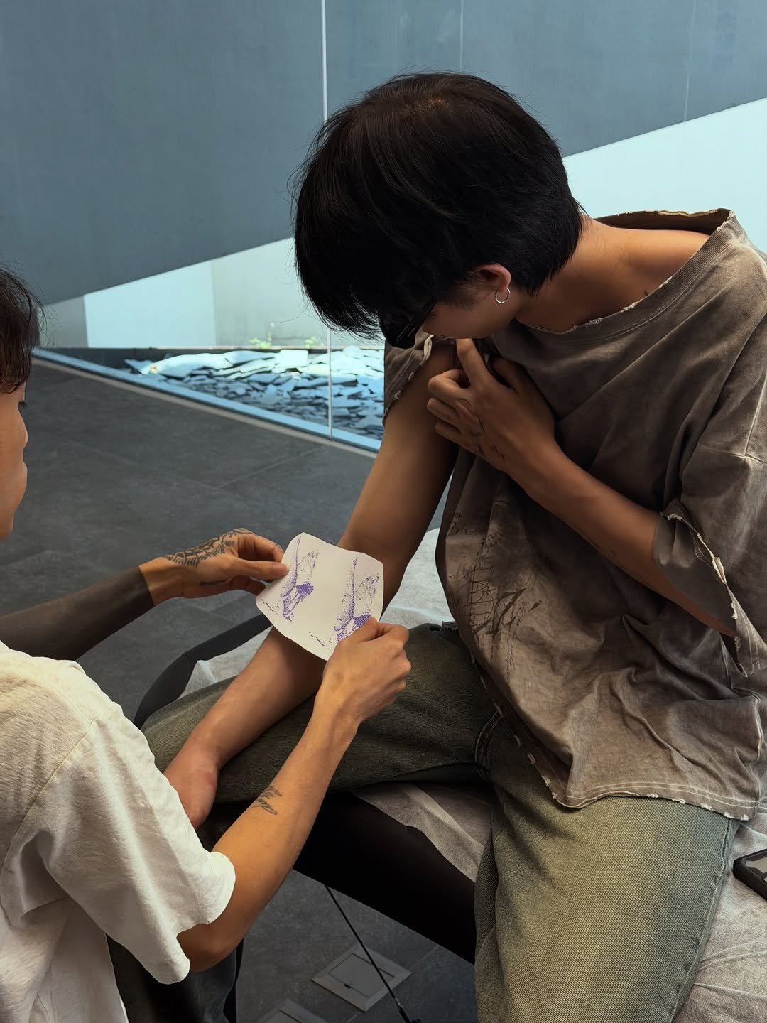 Photo shared by BRIGHT on February 22, 2026 tagging @tantaitattooer. May be an image of one or more people, bandage and text.