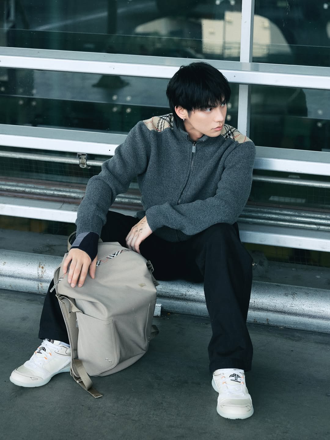 Photo shared by BRIGHT on February 21, 2026 tagging @burberry. May be an image of one or more people, bangs, duffle coat, parka, sweatpants and text.