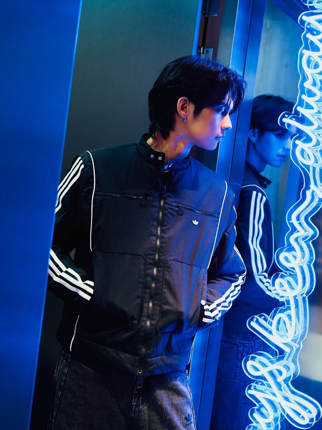 Photo shared by BRIGHT on November 10, 2025 tagging @adidasoriginals, and @adidasthailand. May be an image of one or more people, makeup, mirror, bolo tie and text.