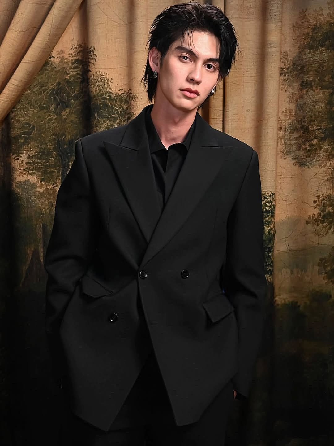 Photo shared by BRIGHT on February 23, 2026 tagging @burberry. May be an image of one or more people, dinner jacket, blazer, suit and text.