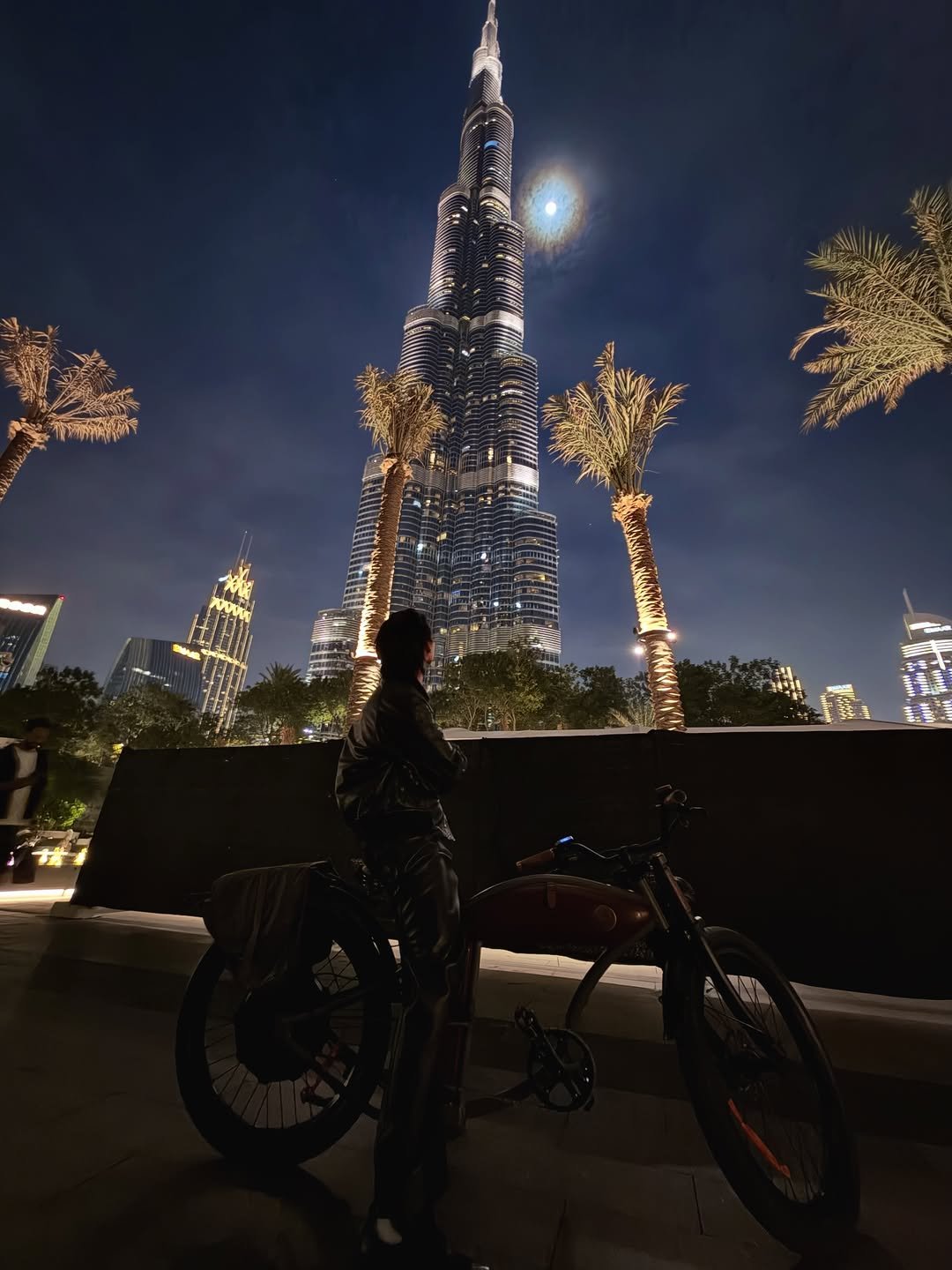 Photo by BRIGHT on December 09, 2025. May be an image of christmas tree, bicycle, scooter, night, outdoors and text.