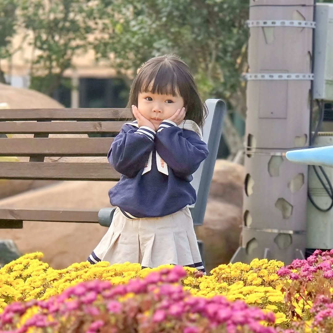 Photo by 루나 on December 23, 2025. May be an image of baby, duffle coat, outdoors and text.