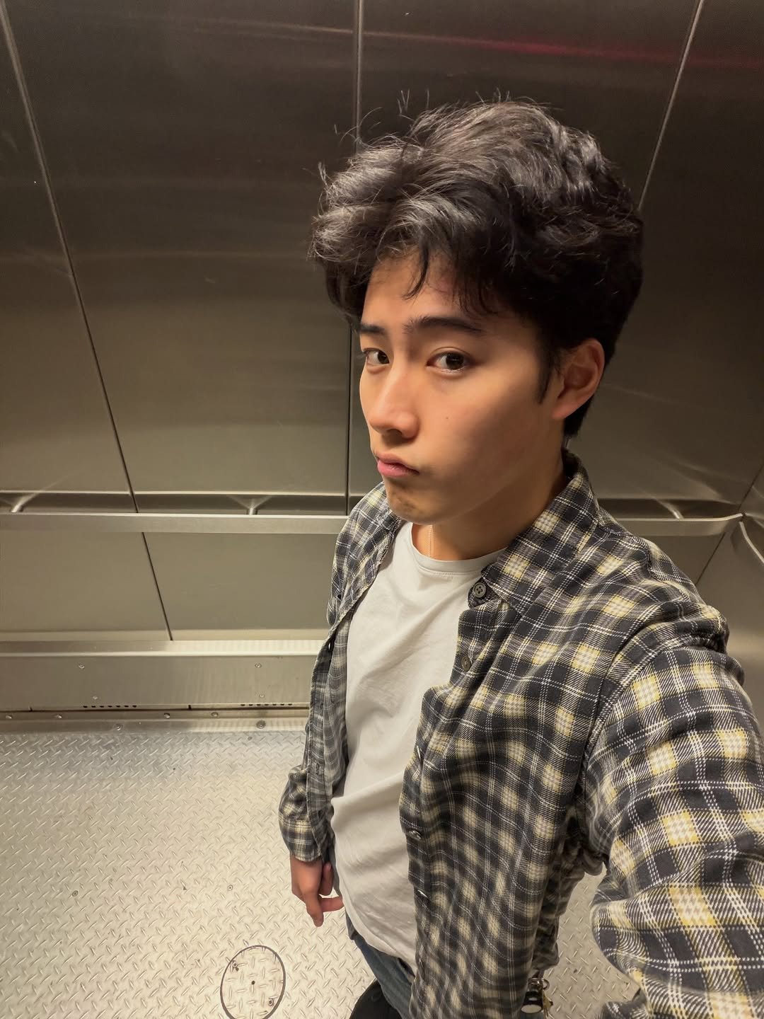 Photo by Brian Jung on January 31, 2026. May be a selfie of one or more people, hair, duffle coat, overcoat and text.