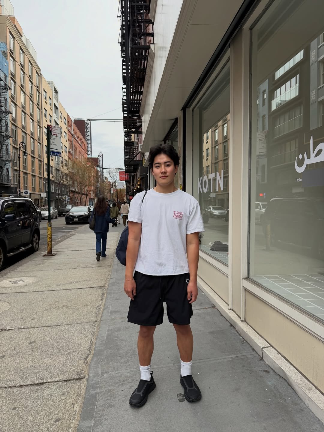 Photo by Brian Jung on March 08, 2026. May be an image of standing, street and text.