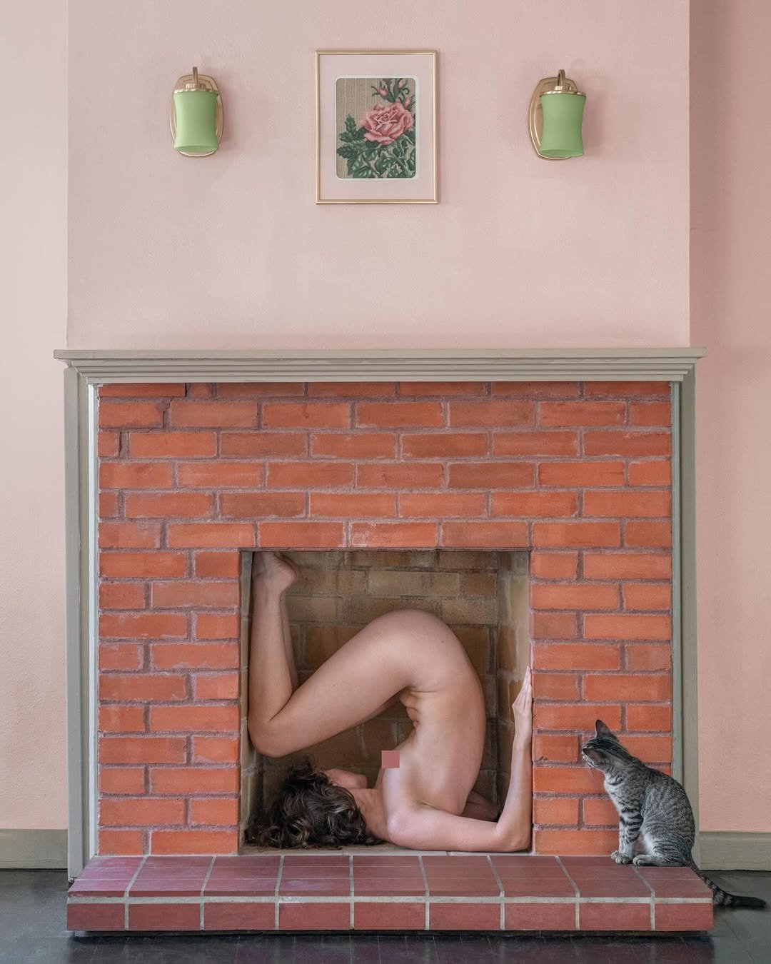 Photo shared by Brooke DiDonato on December 18, 2025 tagging @cherrypanther. May be an image of kitten, fireplace, hearth and text.