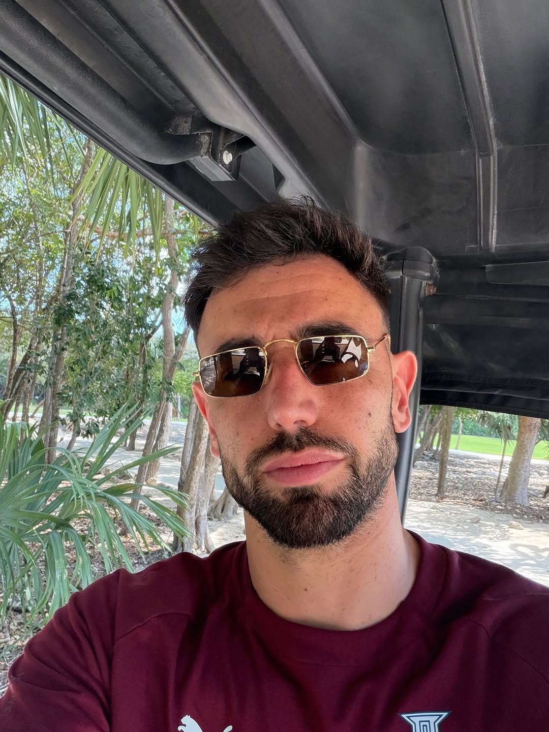 Photo by Bruno Fernandes on April 03, 2026. May be a selfie of one or more people, beard, people golfing, golf cart, golf course and text.