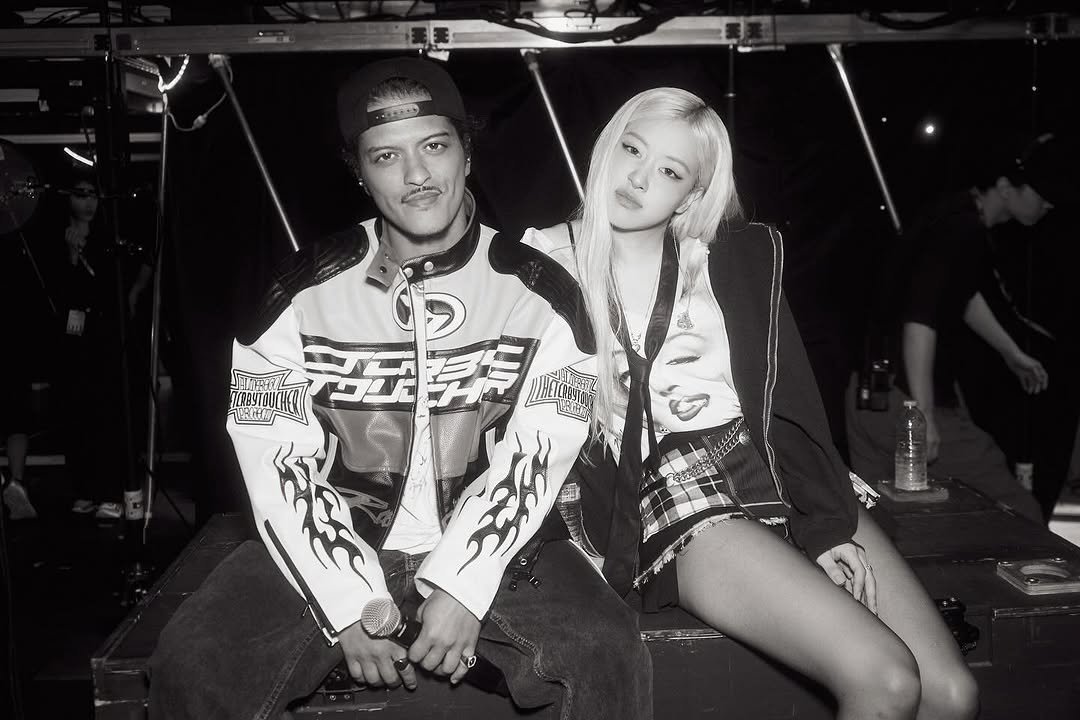 Photo shared by ROSÉ on July 14, 2025 tagging @brunomars, and @katiatemkin. May be a black-and-white image of one or more people, bangs, blonde hair, top, bolo tie and text.