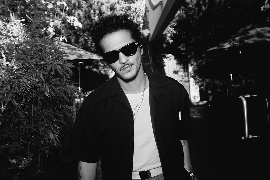 Photo by Bruno Mars on February 20, 2026. May be a black-and-white image of sunglasses and text.